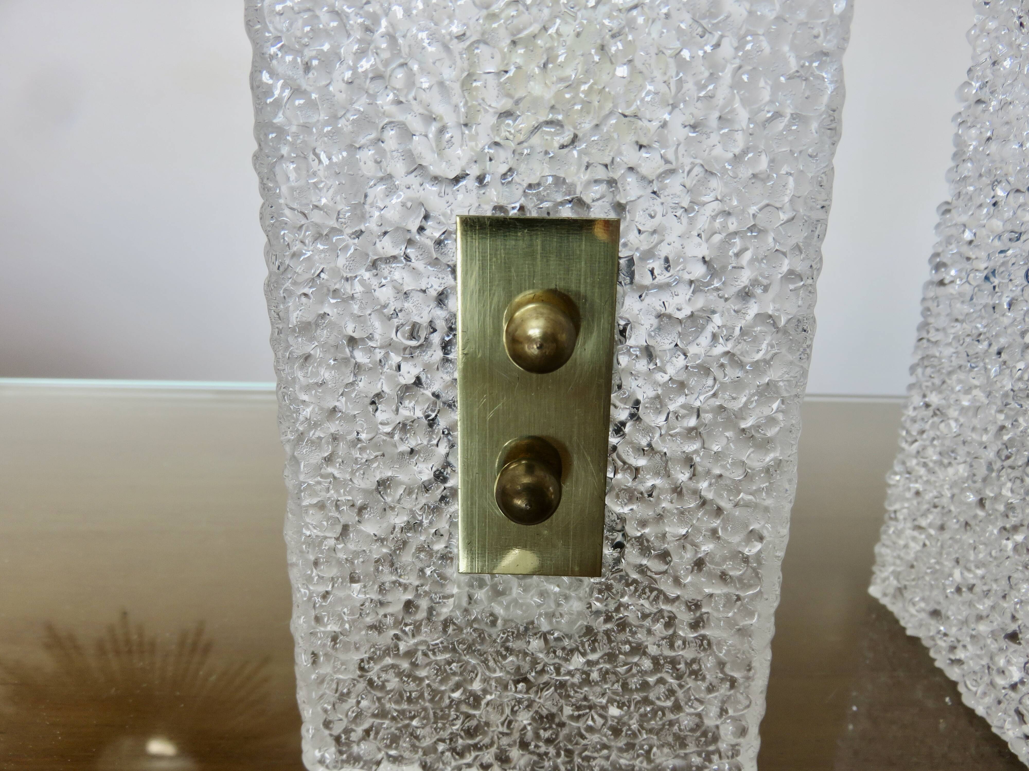 Pair of pull switch wall lights in perspex and gilded brass, France, circa 1960.