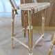 Lot of 3 Maison Louis Drucker light Manila rattan bistro high chairs.