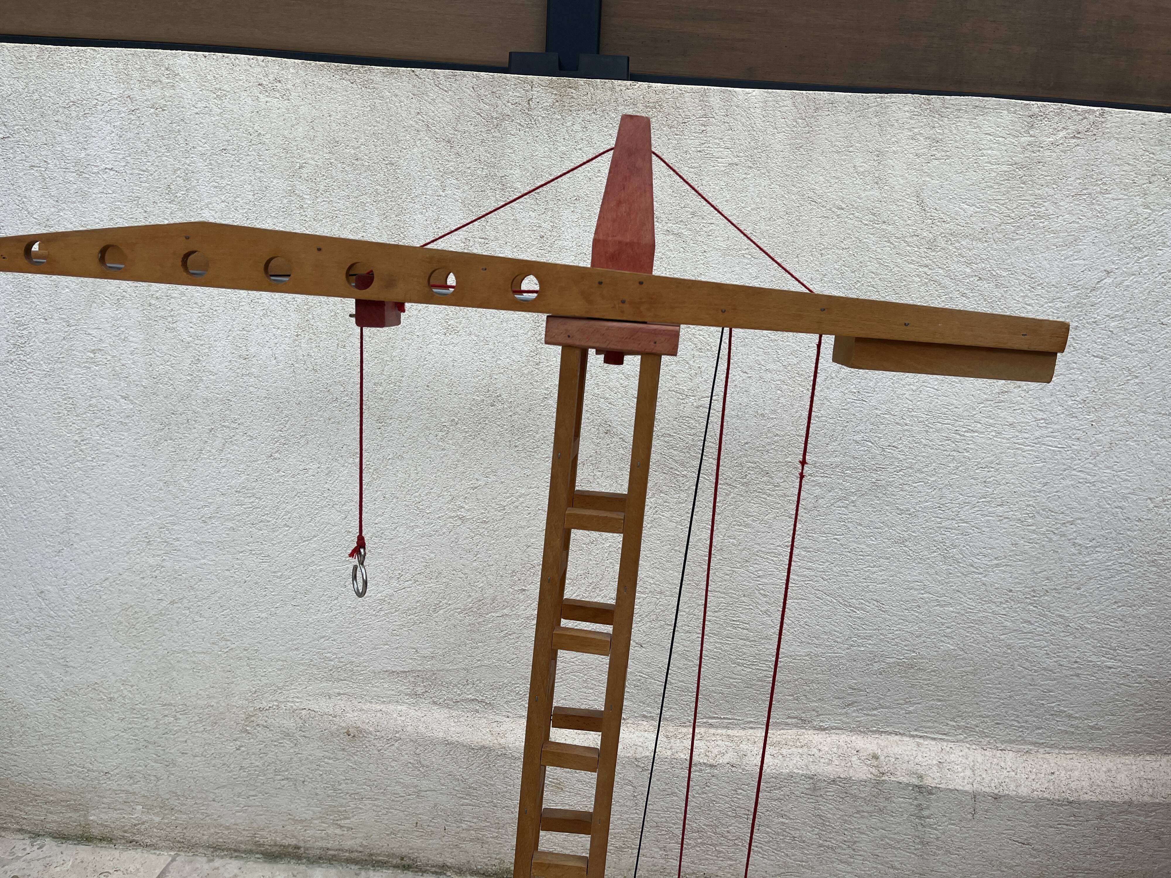 Vintage wooden crane toy from the 60s