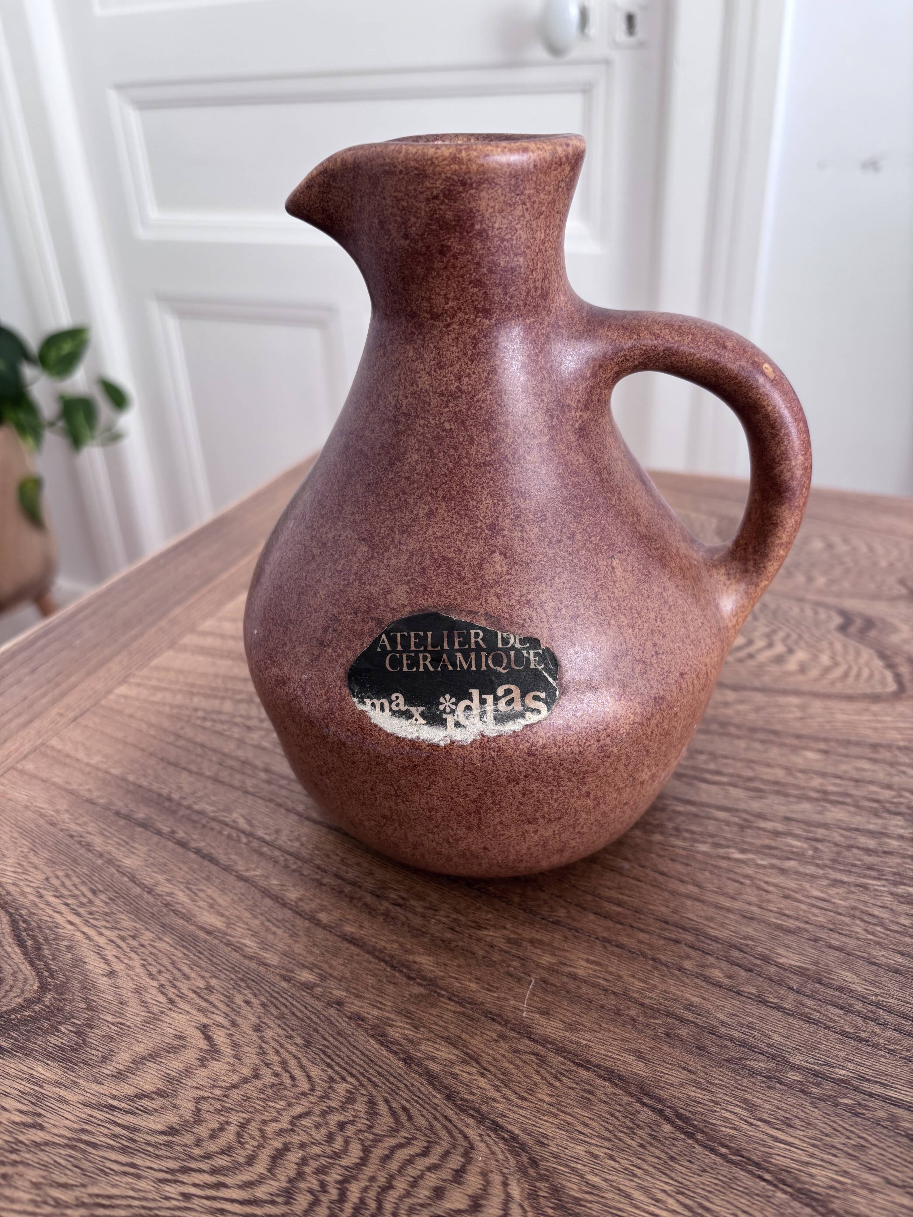 Vintage brown ceramic pitcher signed Max Idlas.