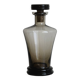 Carafe, old smoked glass bottle with sculpted stopper.