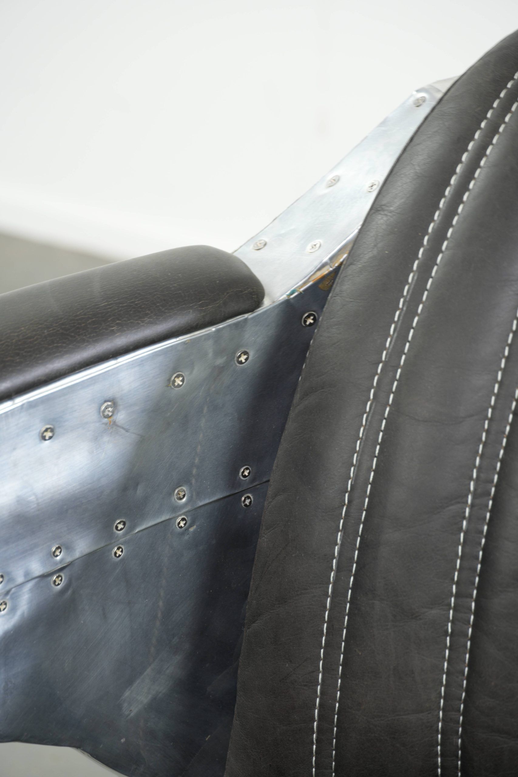 Comfortable cow leather aviator design armchair finished with aluminium