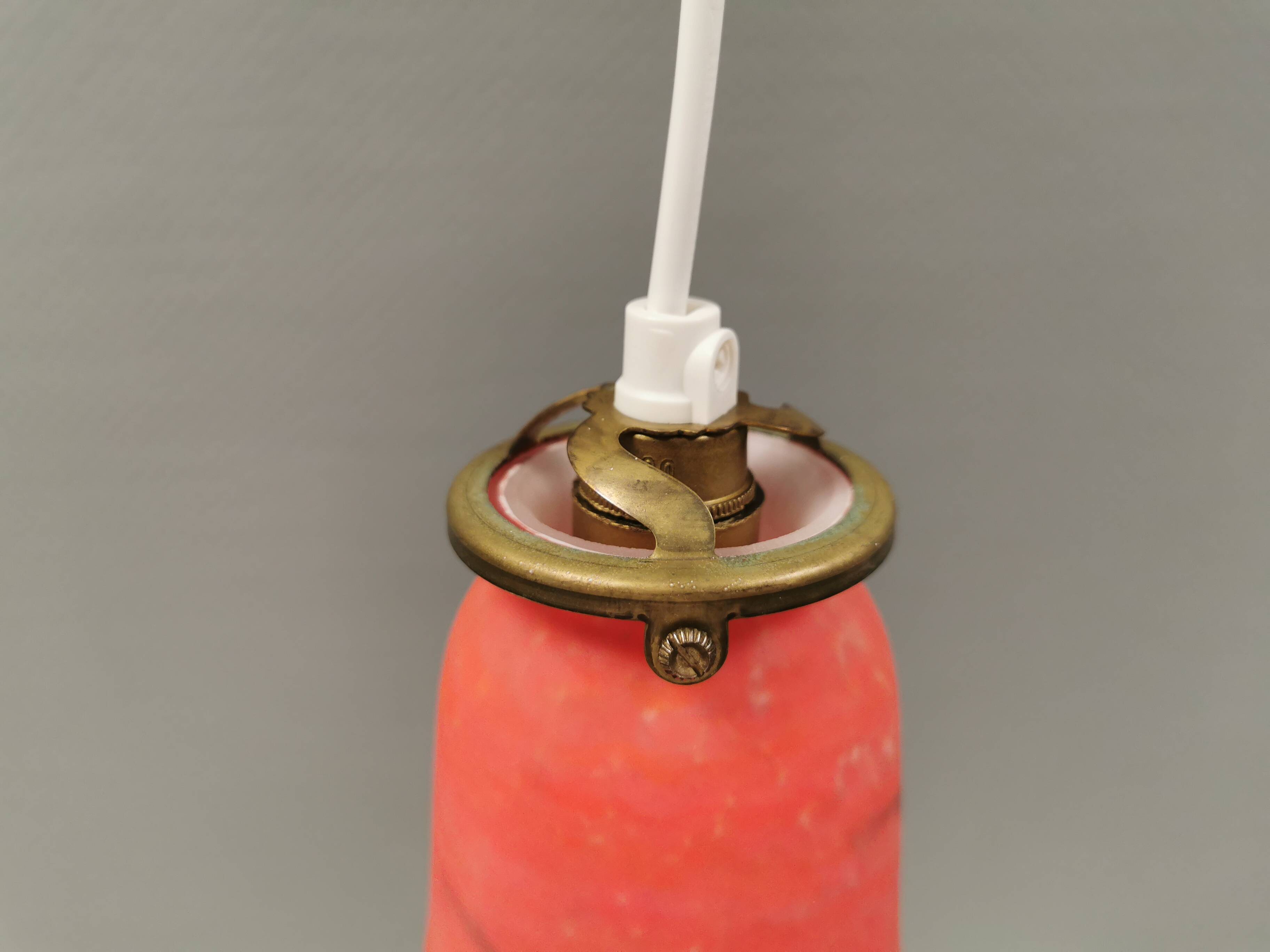 Small, beautiful hanging lamp in Art Deco style with brass top.
