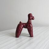 Chien en céramique émaillée rouge.
