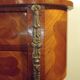 Louis XV style bedside table with varnished marquetry.