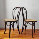 4 antique curved wood and cane chairs