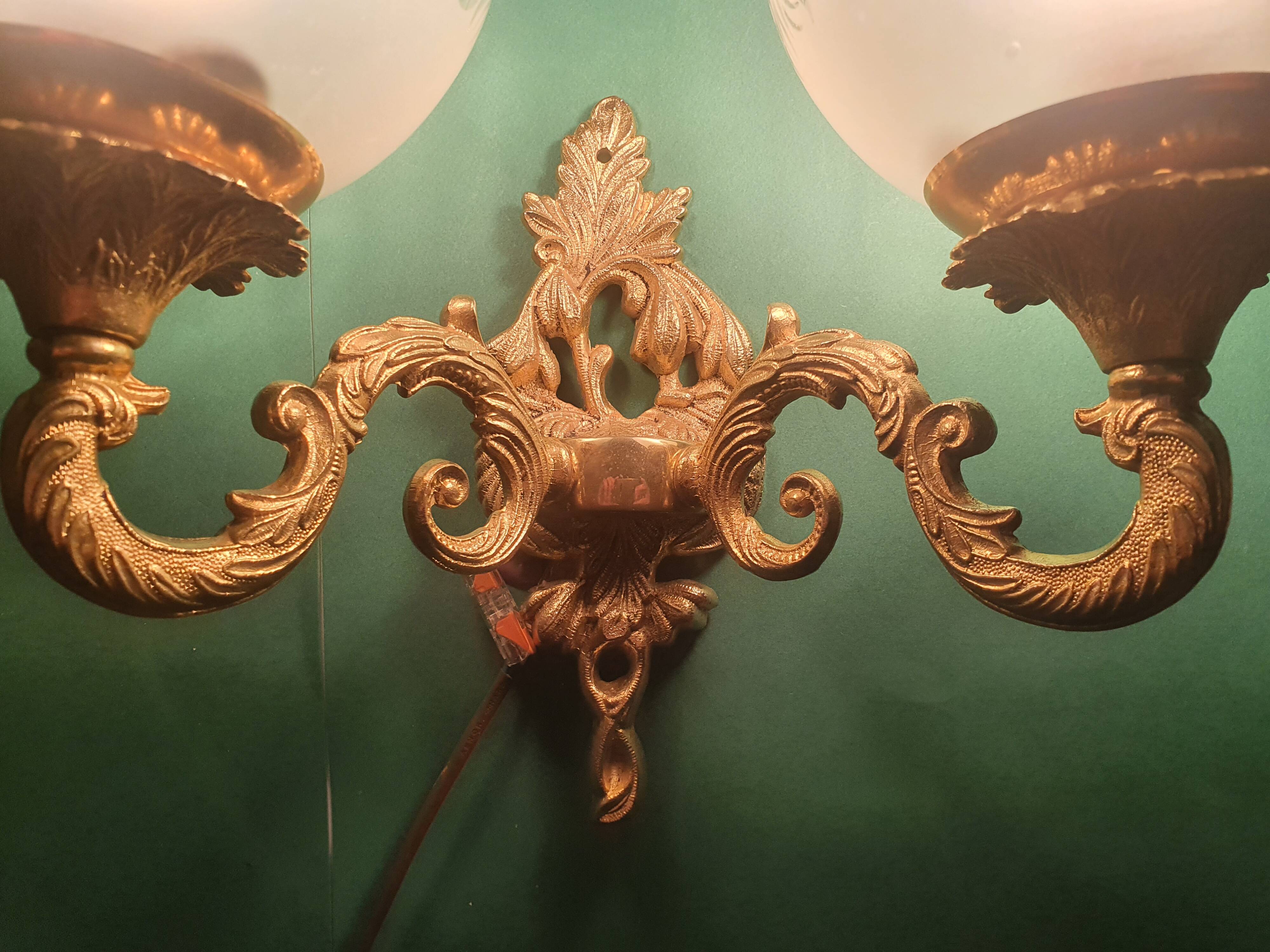 Pair of large double-light wall sconces in vintage brass and glass