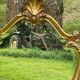 Beveled gilded wood mirror with violin shapes, Louis XV baroque style shell