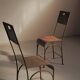 Paire de chaises en acier et tôle rivetée, vers 1920