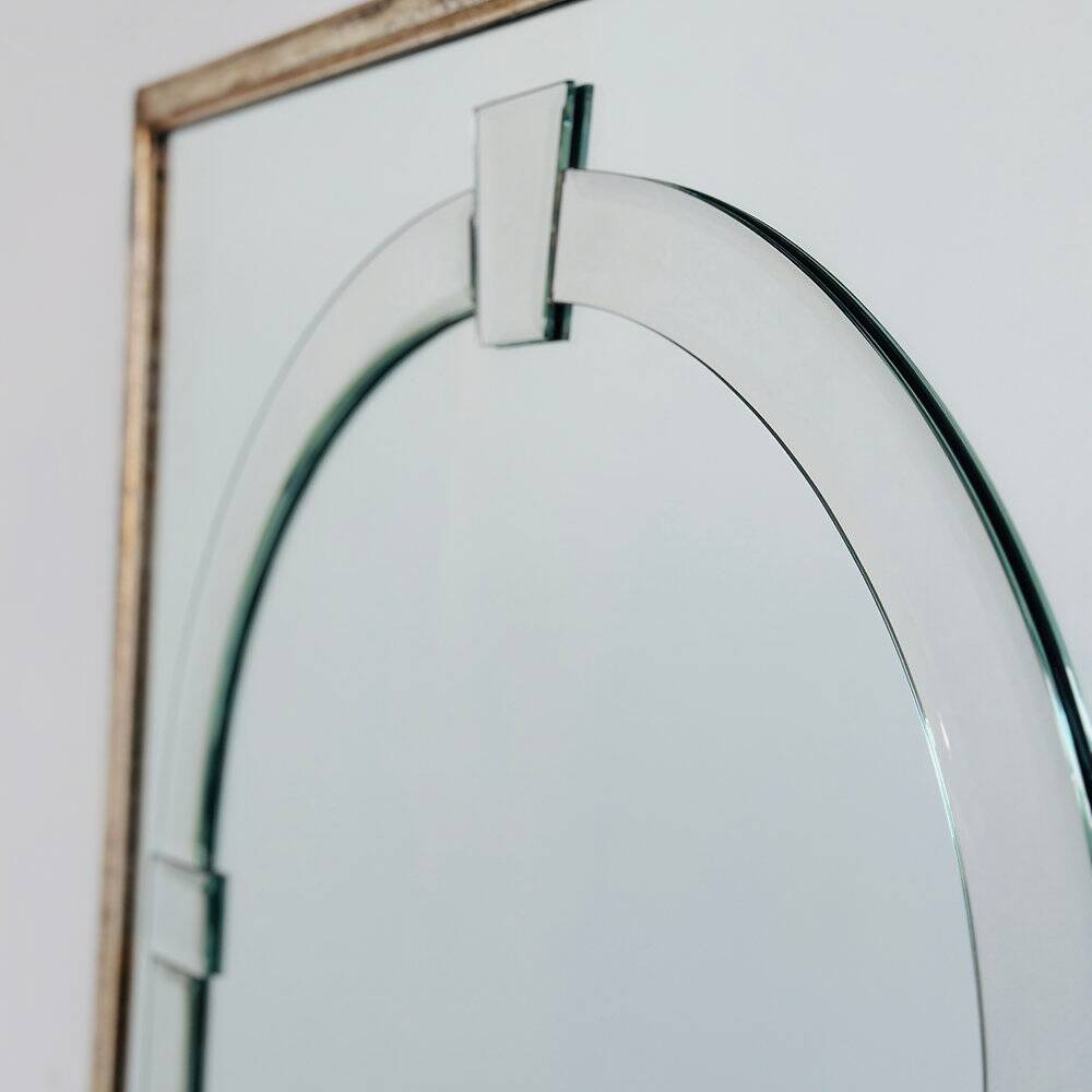 Large Art Deco style beveled wall mirror with architectural arch design