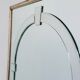 Large Art Deco style beveled wall mirror with architectural arch design