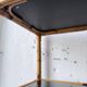 Rattan bookshelf and black glasses
