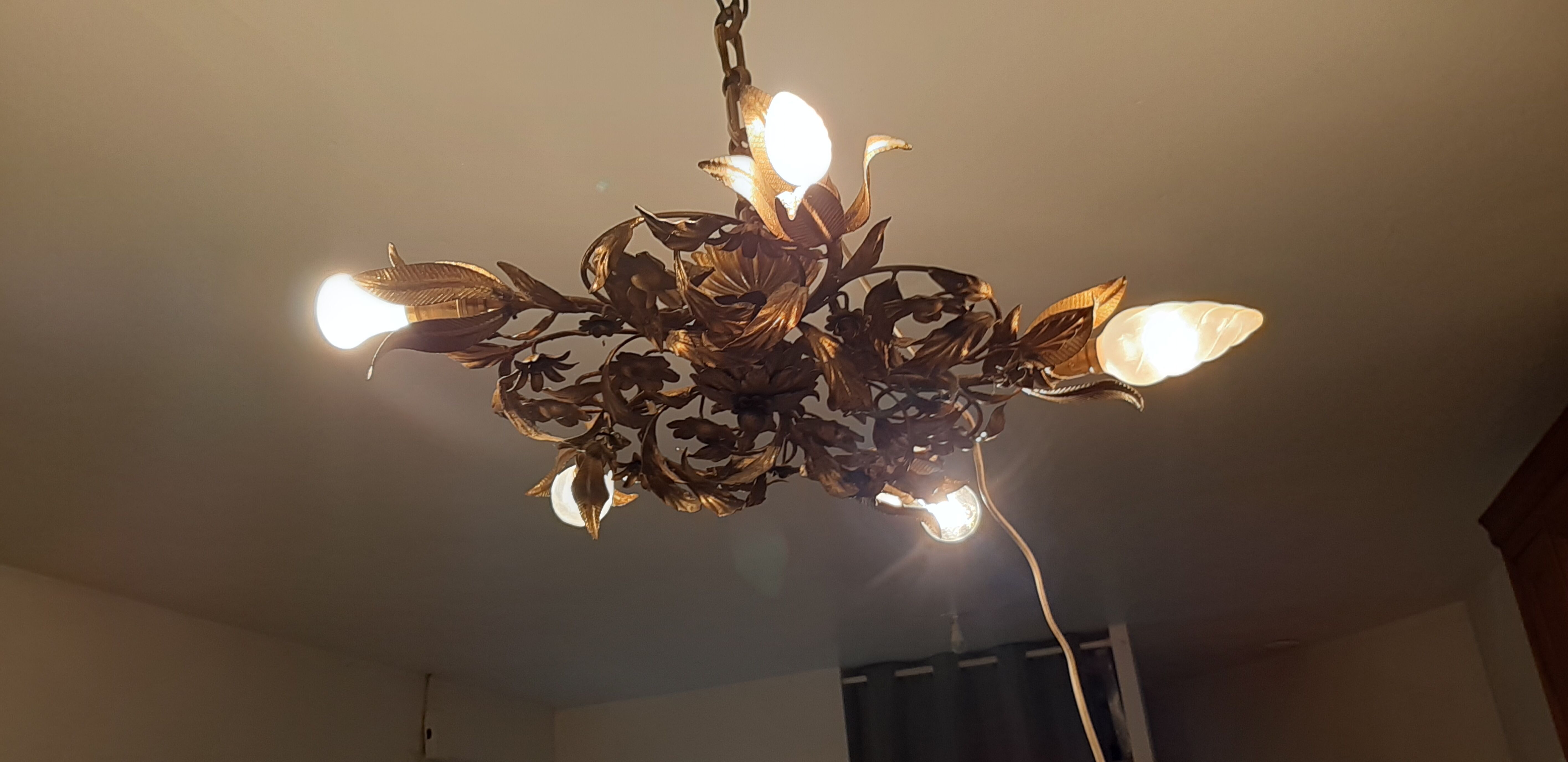 Vintage chandelier in gilded metal