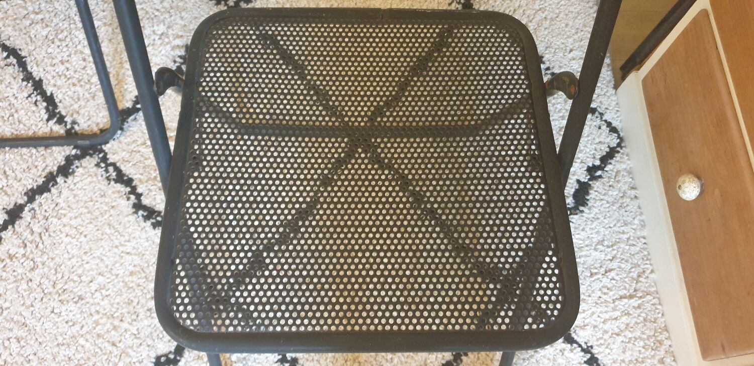 Pair of folding chairs in perforated metal