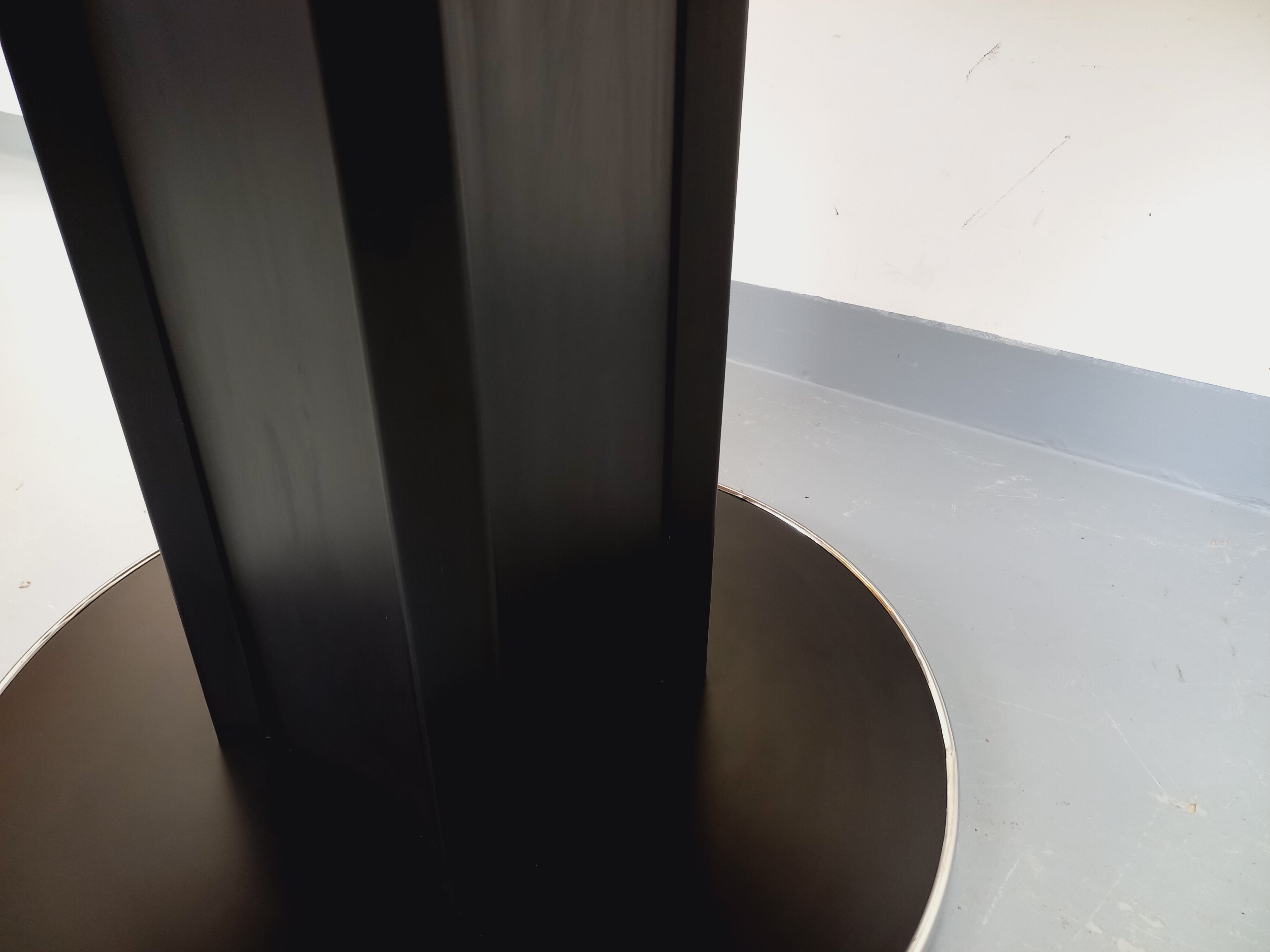 Vintage dining table in melamine with a black wood effect and chrome metal.