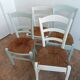 Suite de 4 chaises en bois et paille