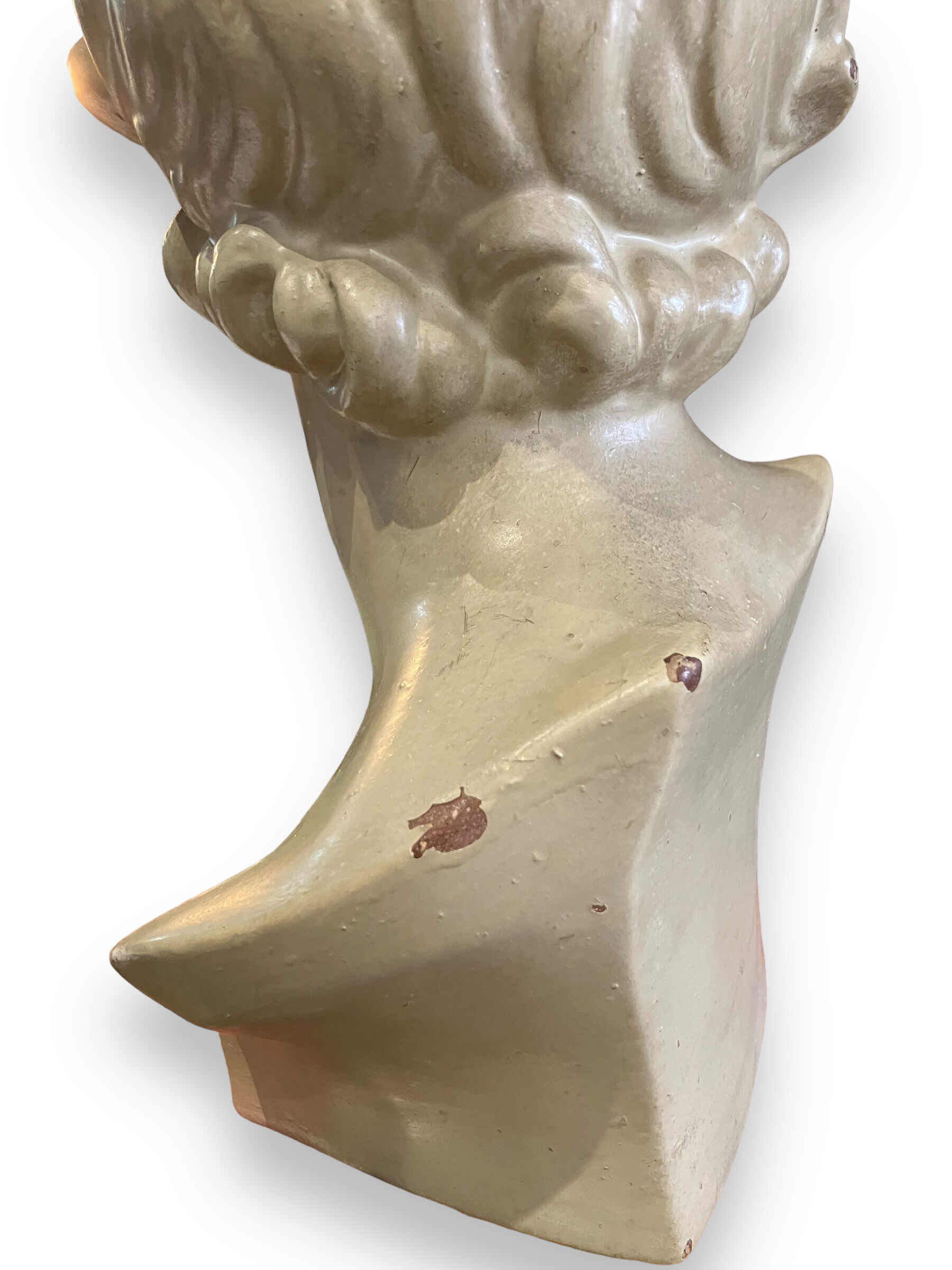 Bust of eros in glazed terracotta