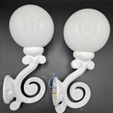 Pair of white enameled cast iron wall sconces, mid-20th century