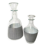 Set of 2 black and white houndstooth glass carafes from the Arques crystal factory. Rare.