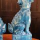 Pair of Foo dog bookends in turquoise glazed ceramic, Manises