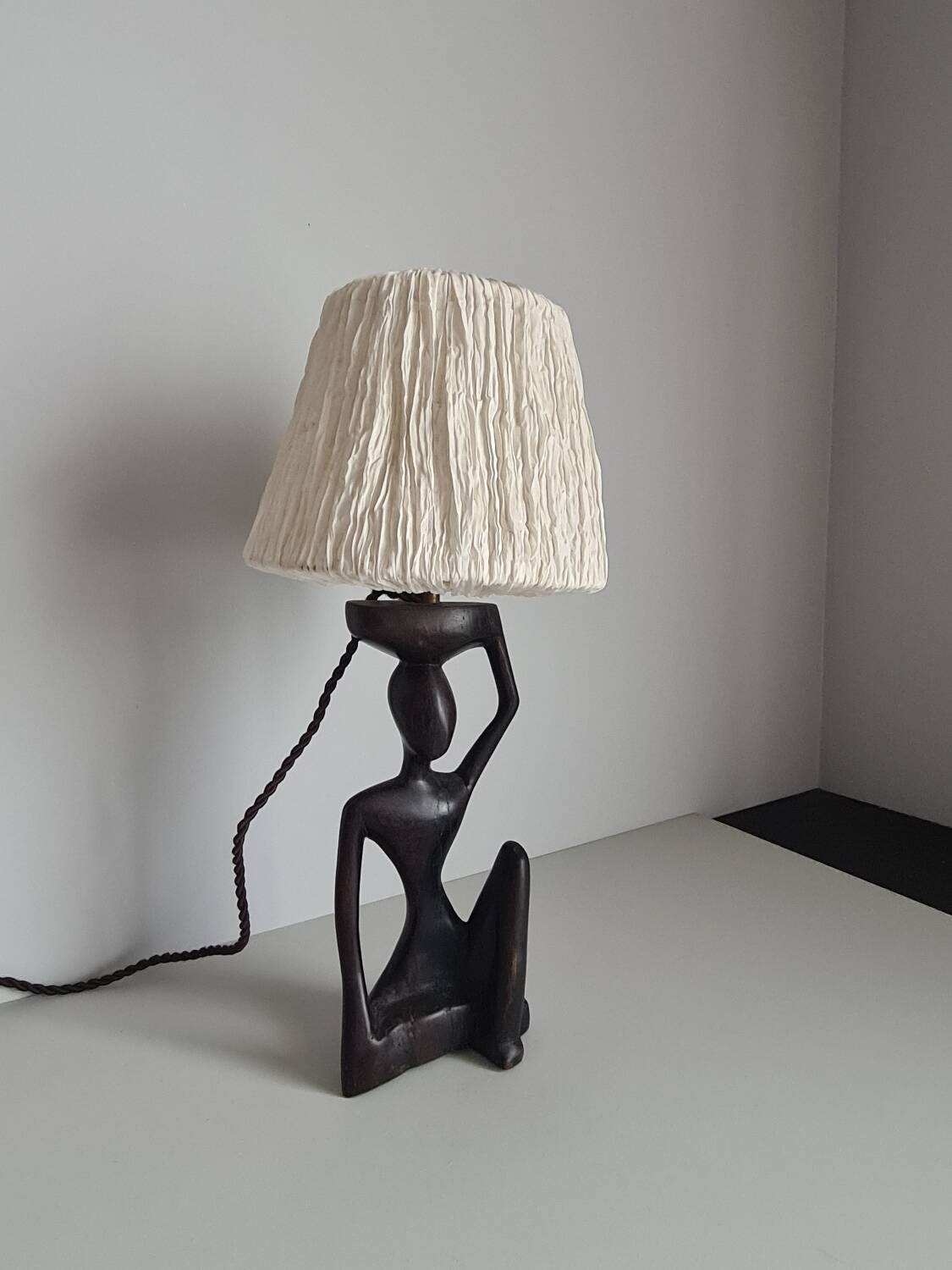 Ebony lamp with seated woman / 1930s