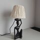Ebony lamp with seated woman / 1930s