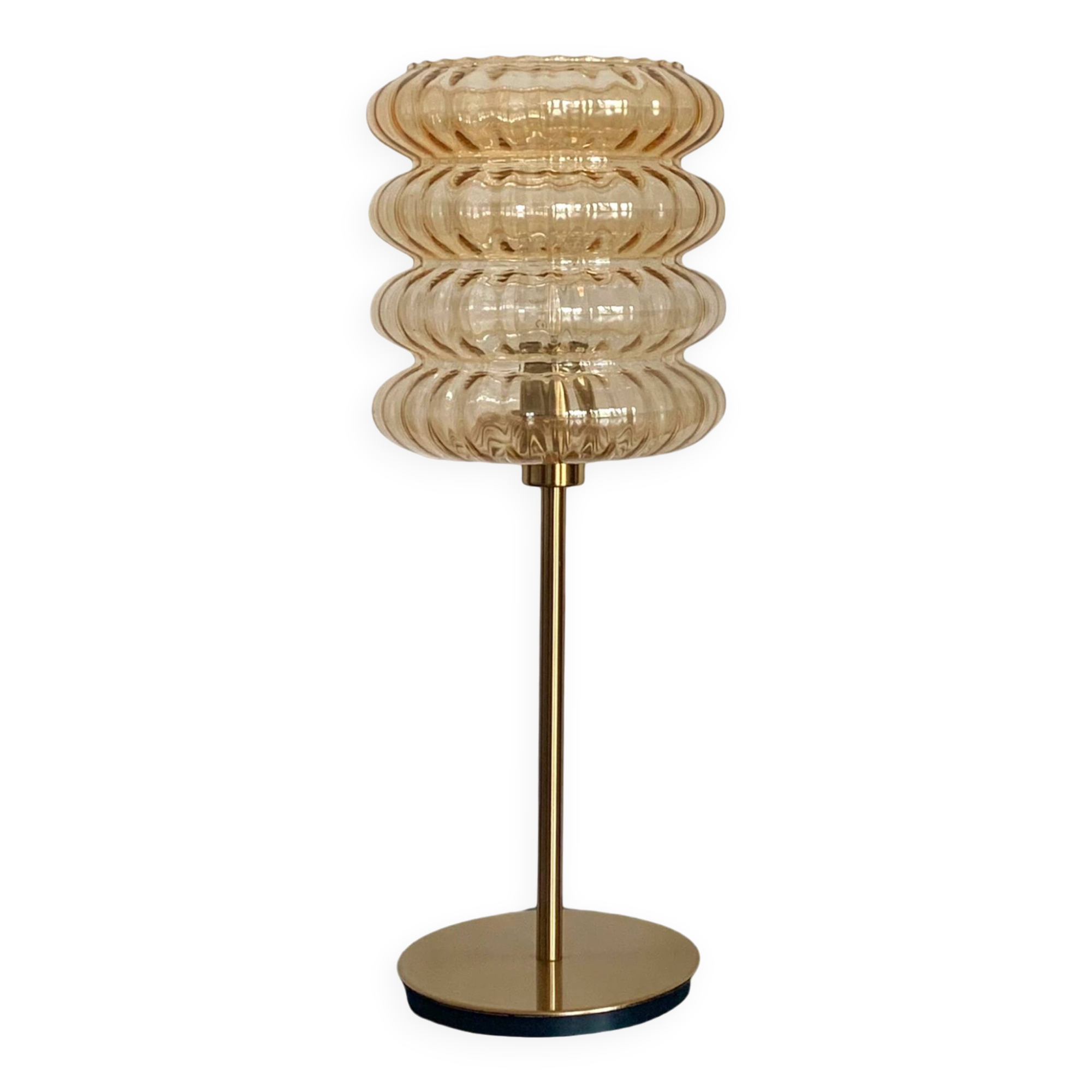 Table lamp with an old vintage golden striped globe and a golden foot