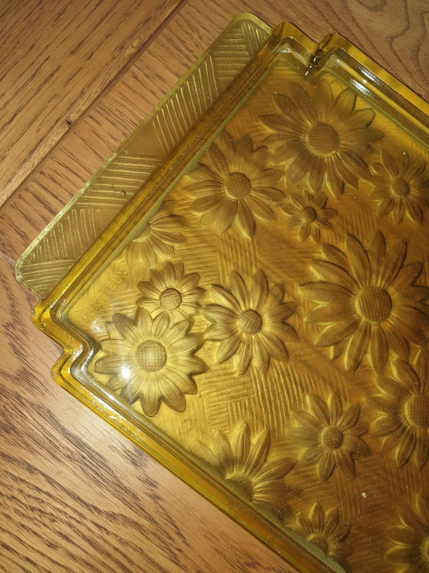 Pressed glass yellow bowl with floral pattern by Portieux.