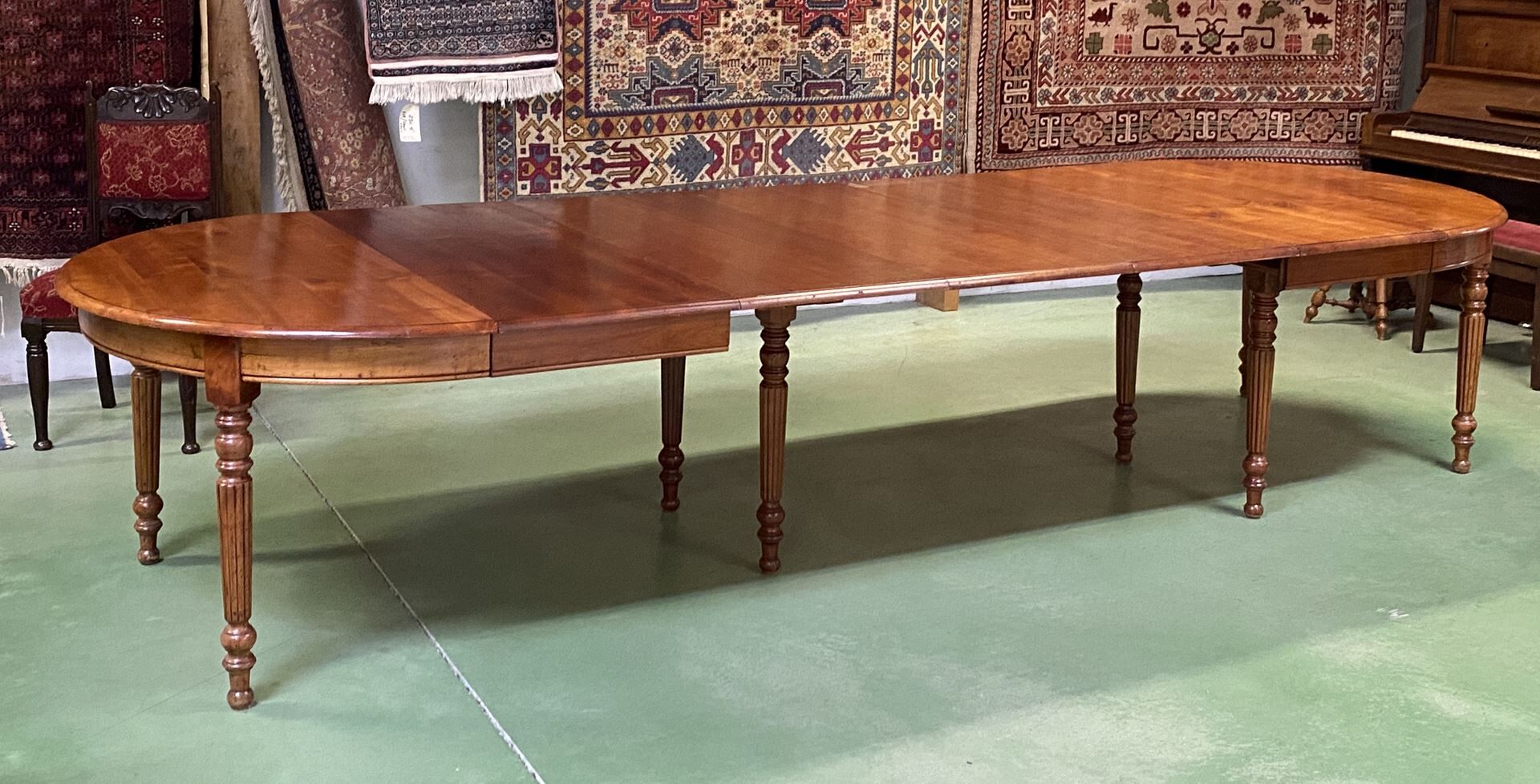 Louis Philippe round table 8 feet in cherry with 6 extensions