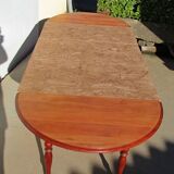 Extendable panel with pans on wheels in cherry