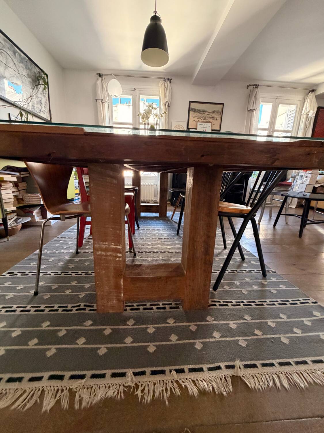 Magnificent wooden table with a glass top.