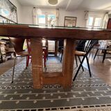 Magnificent wooden table with a glass top.
