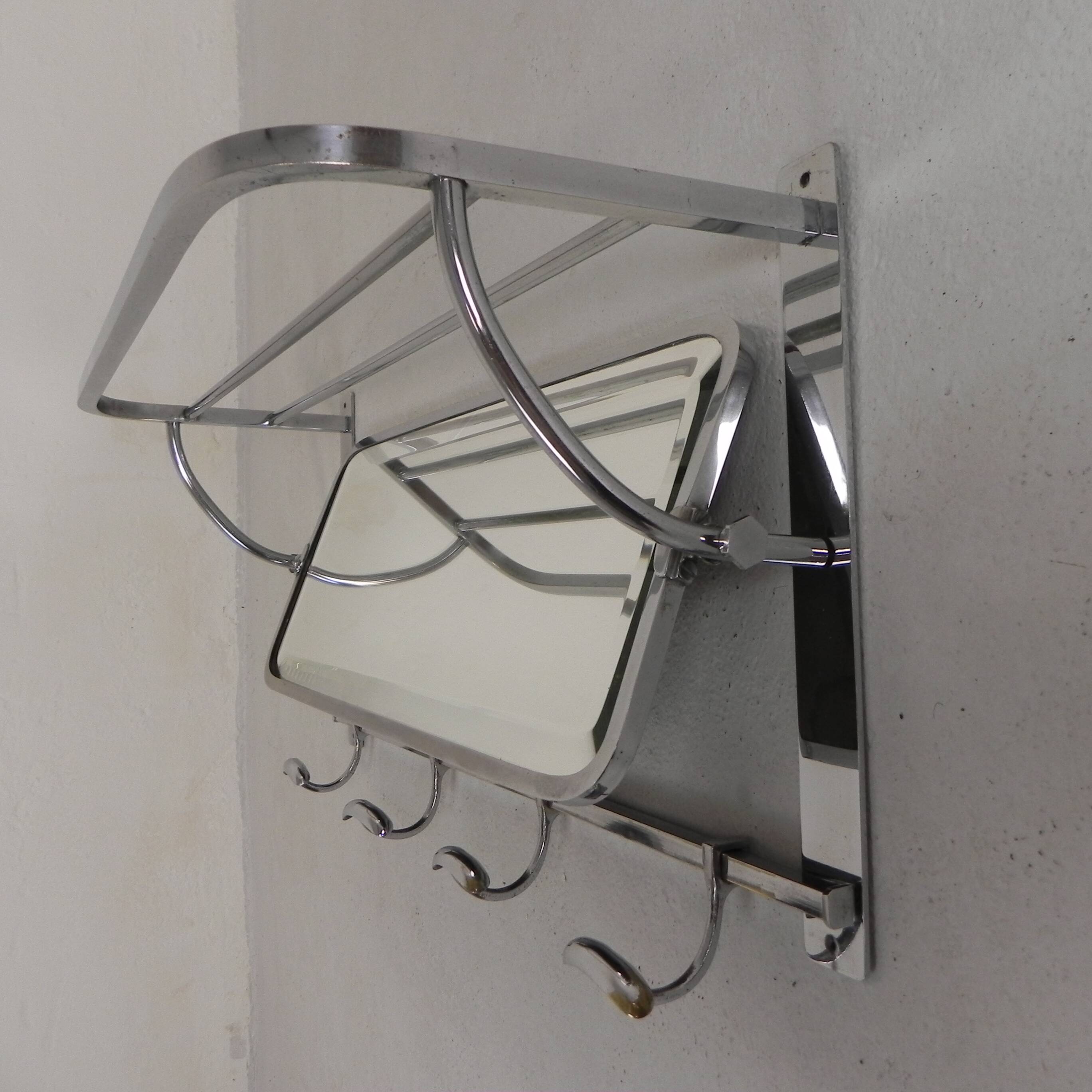 Art Deco wall coat rack with a bevelled mirror adjustable in a chrome frame, 1930s.