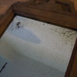 Old carved wooden pediment mirror