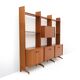 Library with wooden uprights by A.V. Contemporary Furnishings, 1960s.
