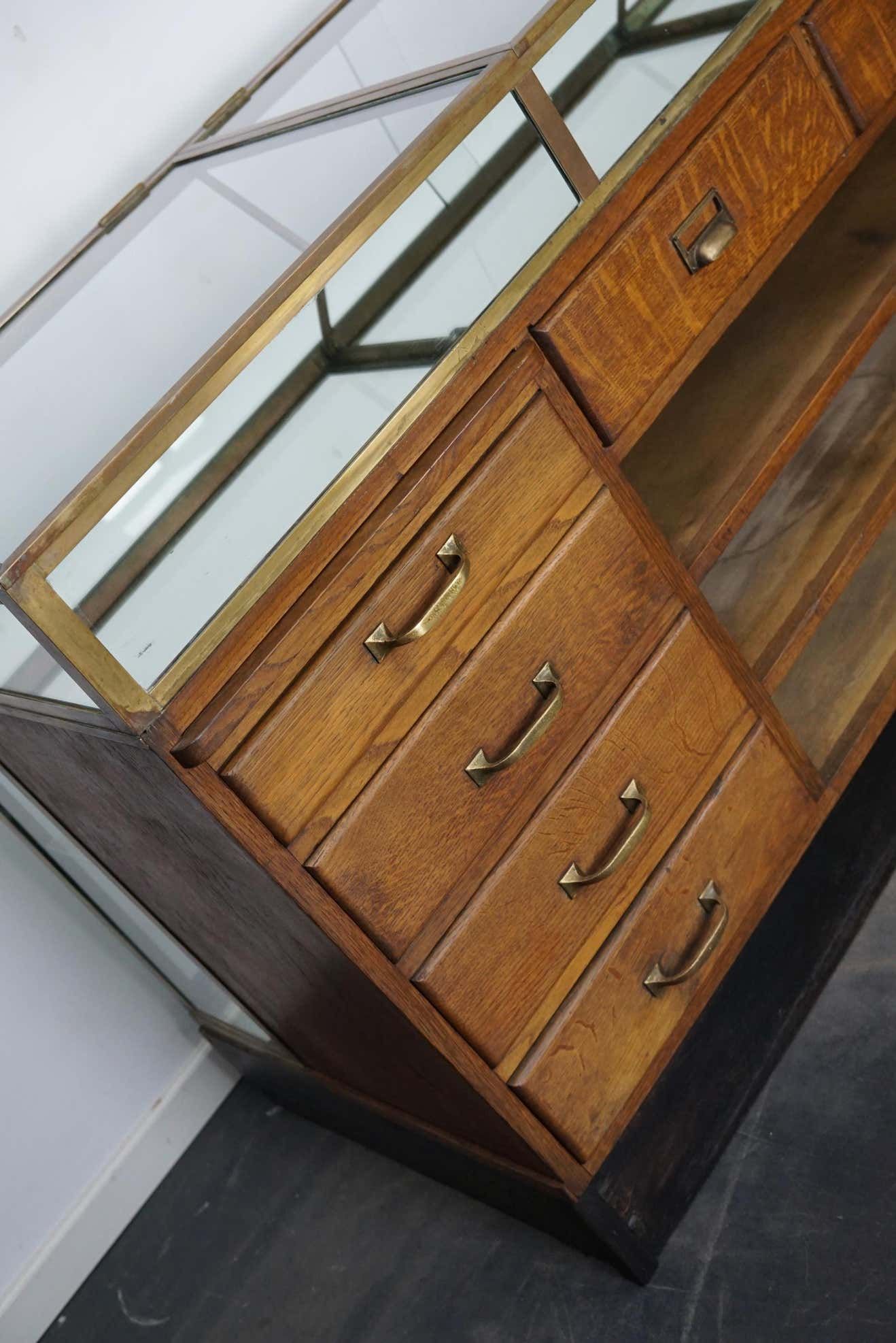 Counter or shop window in oak glass and brass France around 1920