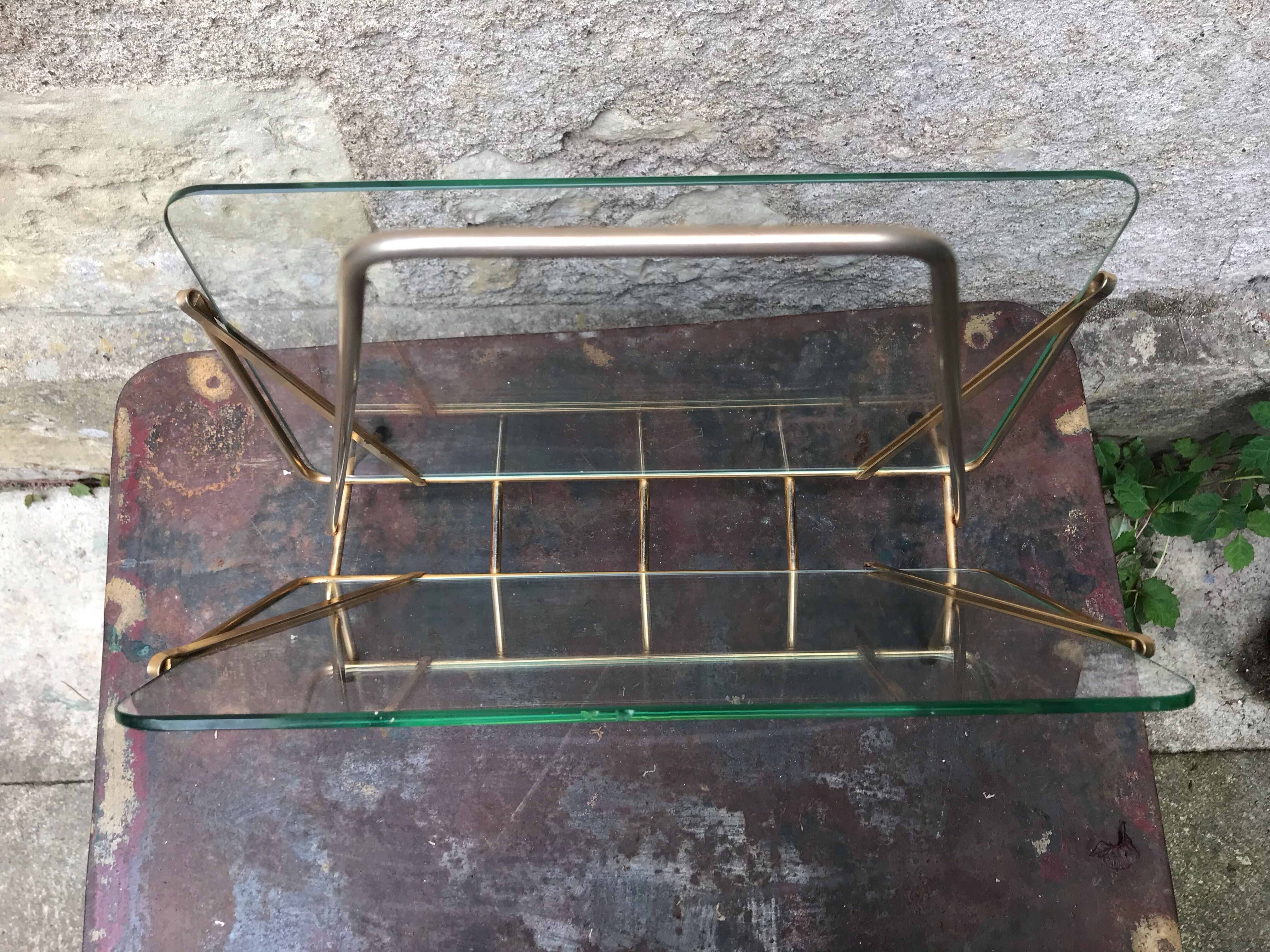 Glass and gold metal magazine door