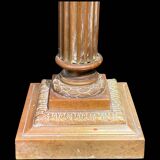 Bronze candle holder with floral motifs.