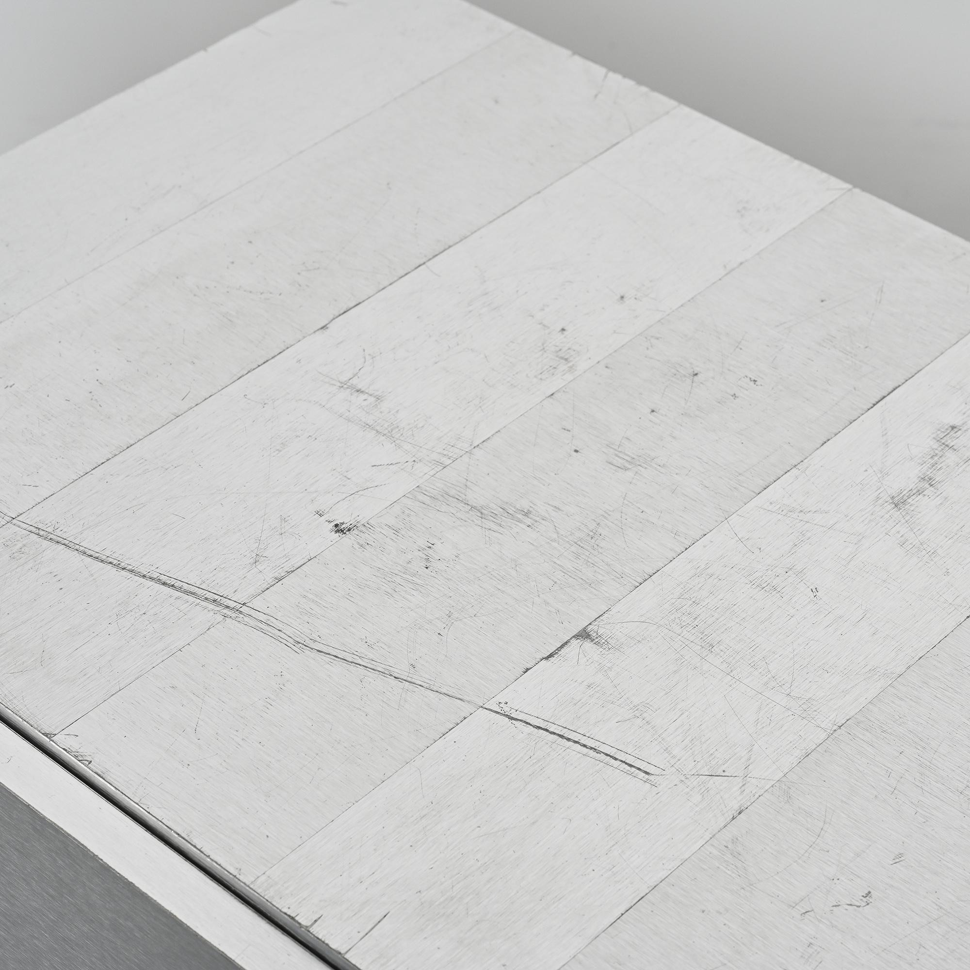 Pair of low buffets in brushed metal, French work, 1970s.