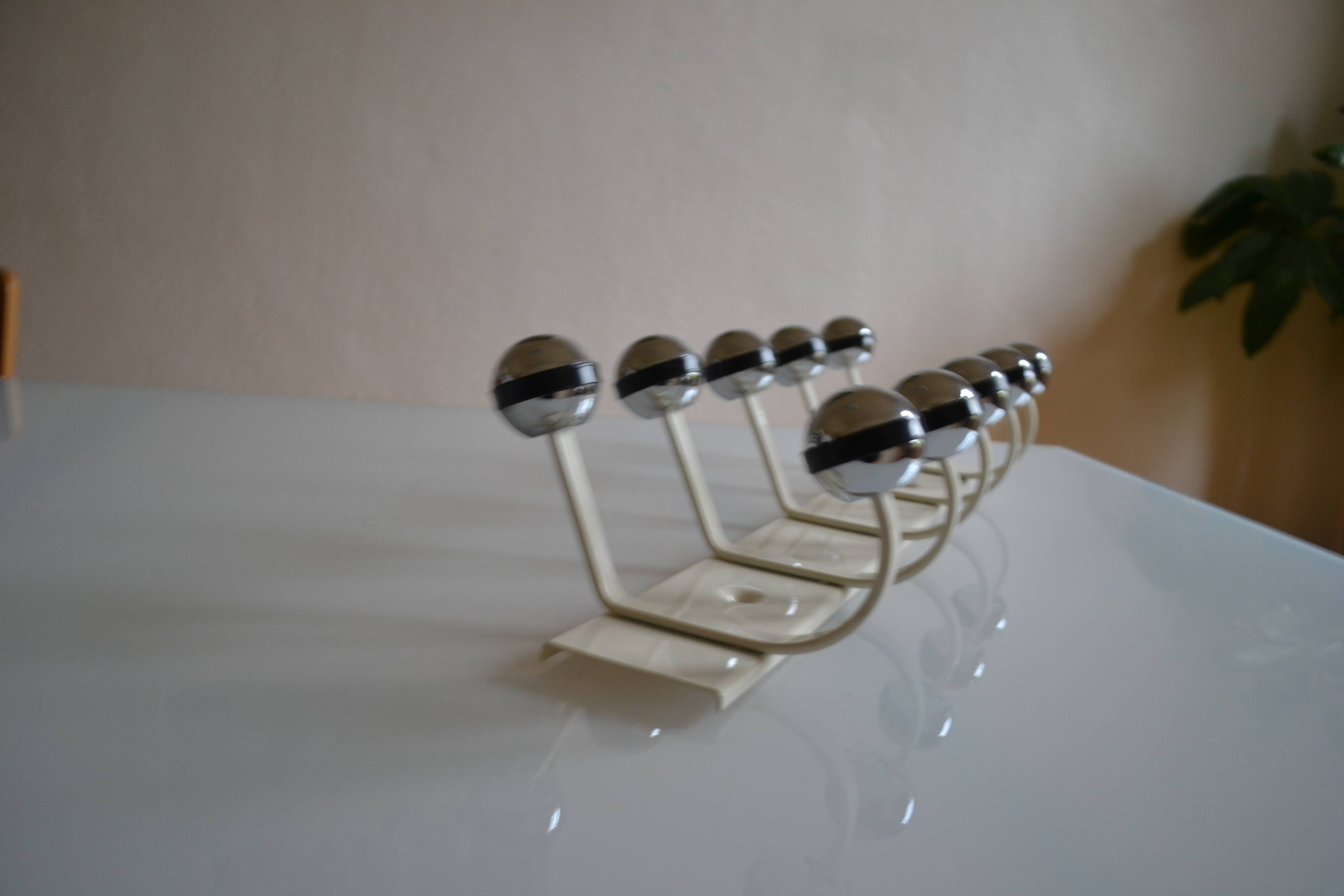 Vintage 1970s wall-mounted coat rack with 10 hooks