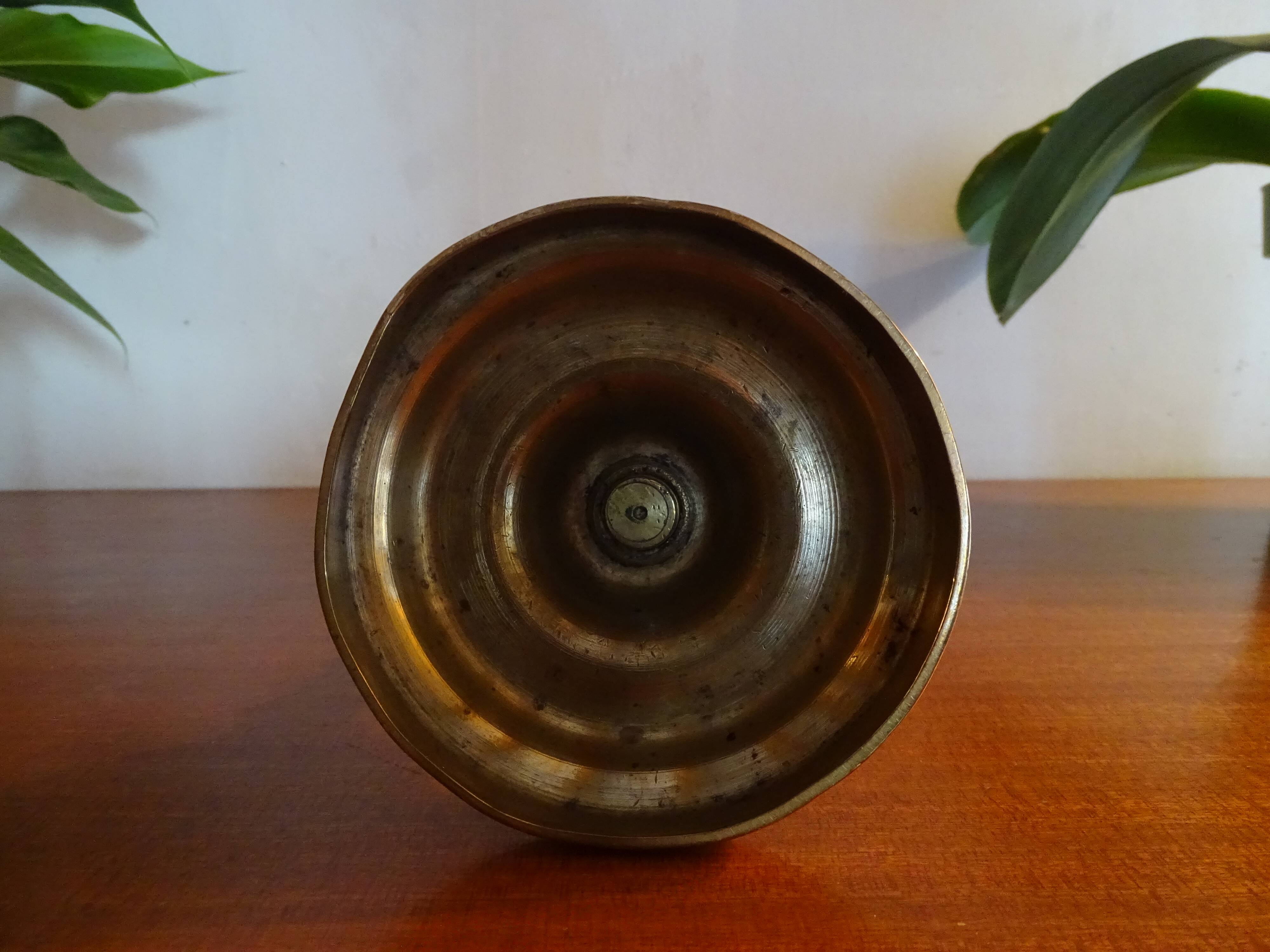 Old brass candle holder and its candle 21.5 cm