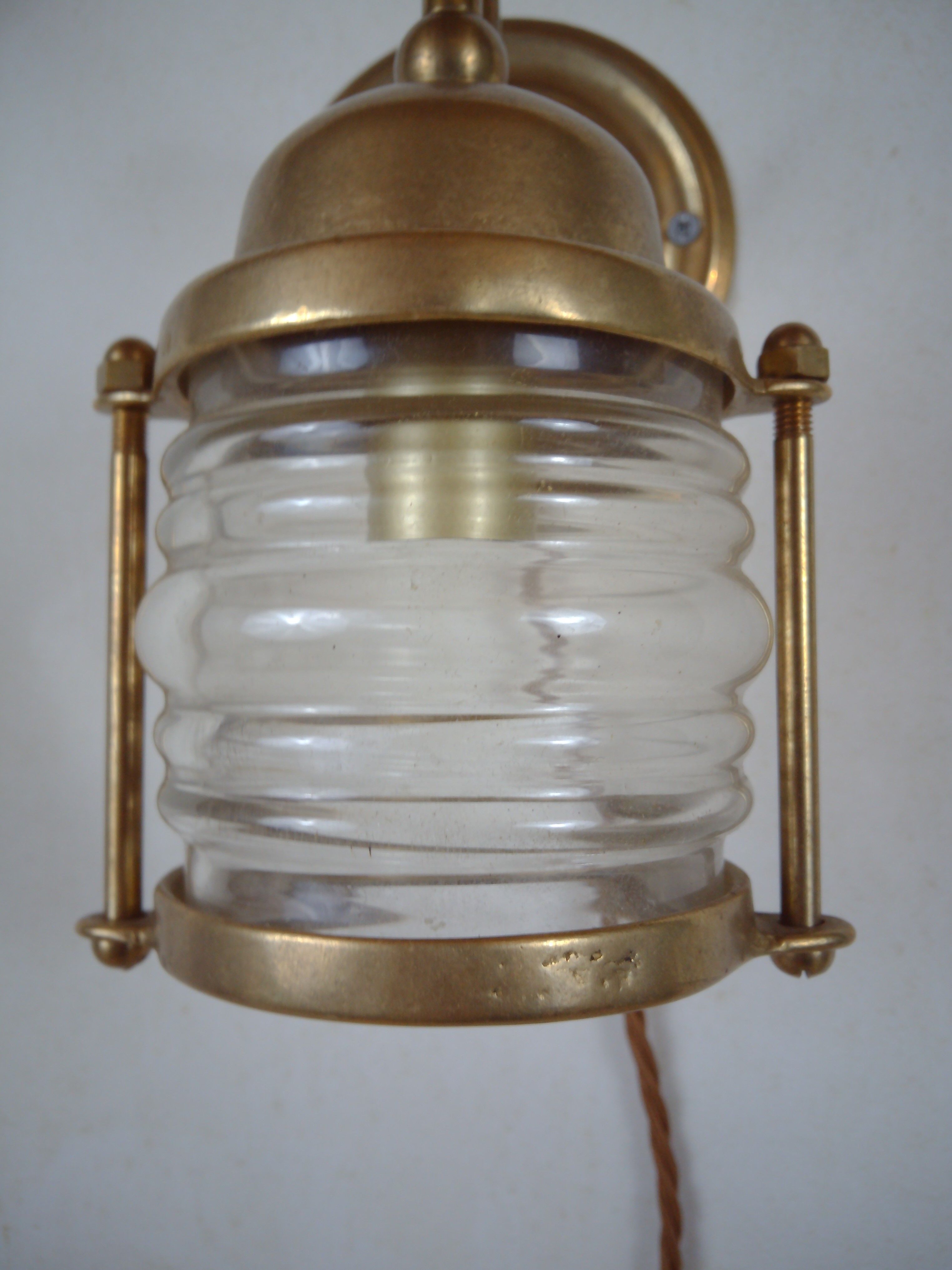 Vintage wallmounted brass lamp from a ship.