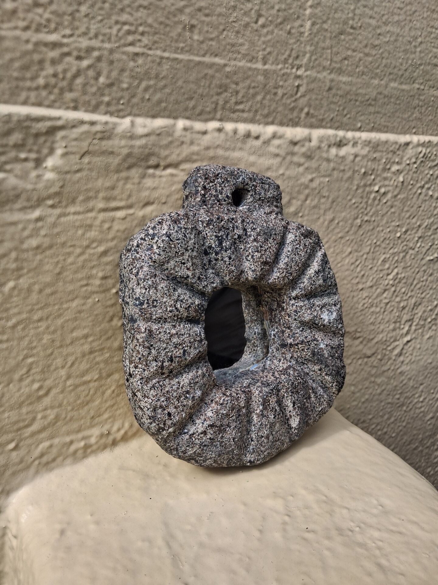 Brutalist mirror in hand-carved natural stone