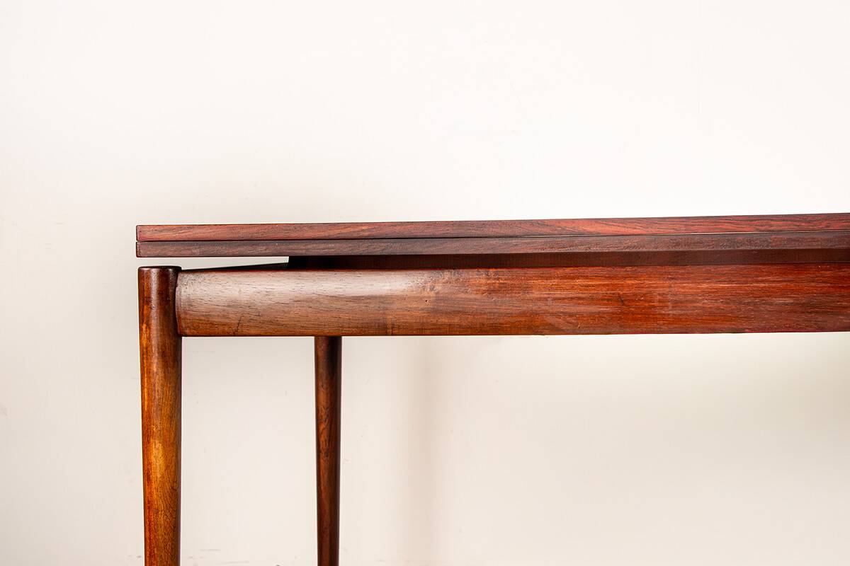 Danish extendable dining table in rosewood and brass by Poul Volther