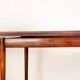 Danish extendable dining table in rosewood and brass by Poul Volther