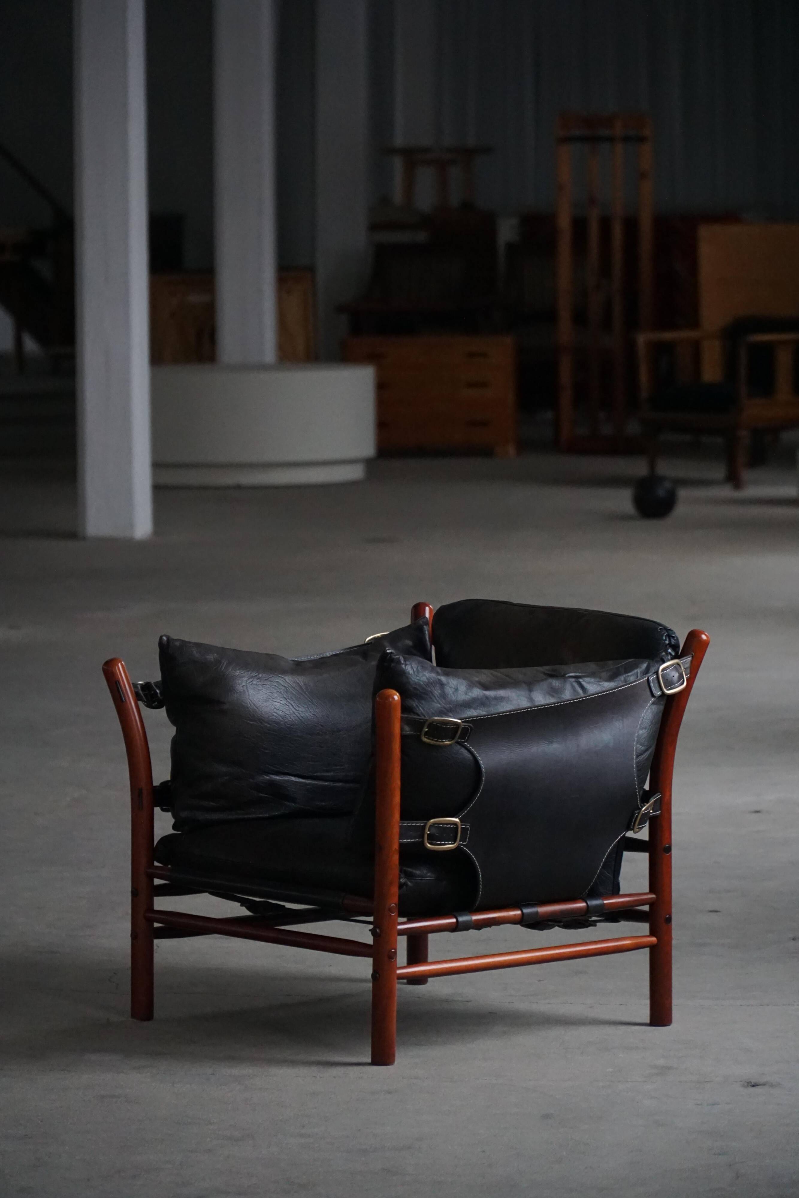 "Lounge chair 'Ilona' by Arne Norell in stained beech and leather, mid-20th century."