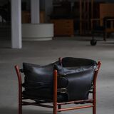 "Lounge chair 'Ilona' by Arne Norell in stained beech and leather, mid-20th century."