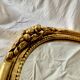 Antique oval wall mirror in gold resin - 63 cm