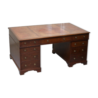 Double-sided partner's desk in walnut, George III, circa 1780, with lion head handles.