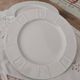 Set of 7 flat plates in white Limoges porcelain geometric decoration in relief